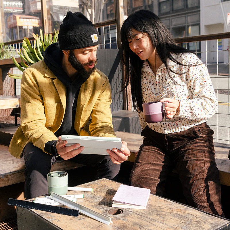 12oz-rise-mug-z9 12oz_rise_coffee_mug_dusty_orchid_couple_city_patio_square.jpg