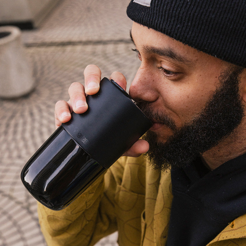 daily-on-the-go-set-h7 16oz_rise_tumbler_black_man_drink_square.jpg