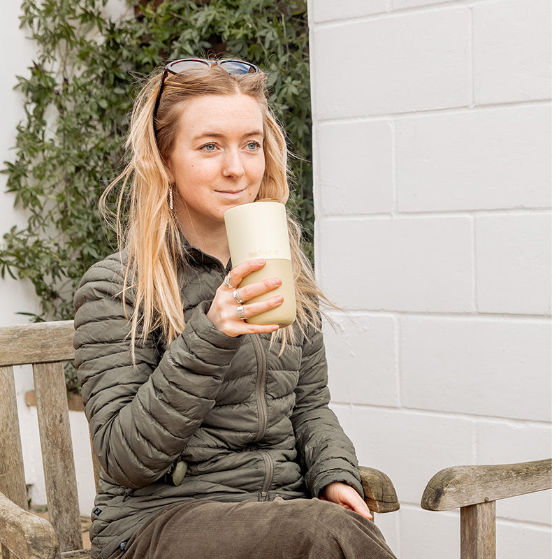 16oz-rise-tumbler-u2 16oz_rise_tumbler_wax_yellow_woman_seat_outside_square.jpg