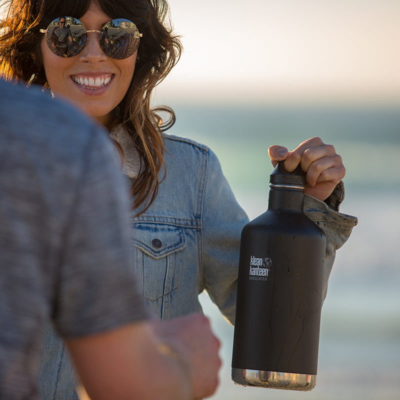 64oz-classic-with-loop-cap-v9 64oz_insulated_classic_black_beach_girl_hand_square.jpg